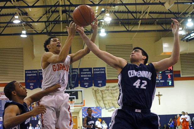 Bishop Gorman's Noah Robotham, left and Centennial's Brandon Page fight for a rebound during a game at Bishop Gorman Thursday, Feb. 7, 2013. Bishop Gorman beat Centennial 79-71 in double overtime.