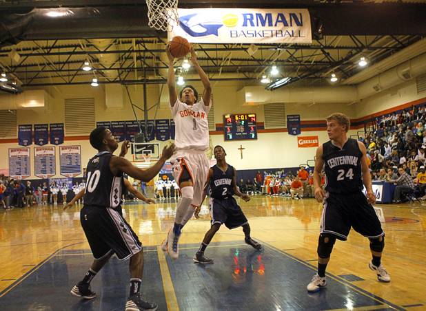 Bishop Gorman's Rashad Muhammad drives to the basket during a game against Centennial High School at Bishop Gorman Thursday, Feb. 7, 2013. Bishop Gorman beat Centennial 79-71 in double overtime.