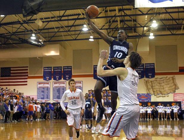 Centennial High School's Marcus Allen puts up the ball over Bishop Gorman's Stephen Zimmerman during a game at Bishop Gorman Thursday, Feb. 7, 2013. Bishop Gorman beat Centennial 79-71 in double overtime.
