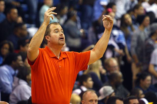 Bishop Gorman's coach Grant Rice calls out to players during a game against Centennial High School at Bishop Gorman Thursday, Feb. 7, 2013. Bishop Gorman beat Centennial 79-71 in double overtime.