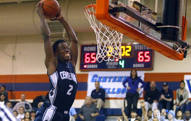 Centennial High School's Malcolm Allen dunks the ball during a game against Bishop Gorman at Bishop Gorman Thursday, Feb. 7, 2013. Bishop Gorman beat Centennial 79-71 in double overtime.
