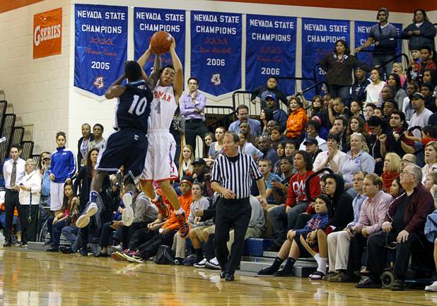 Centennial High School's Marcus Allen fouls Bishop Gorman's Trey Kennedy as he catches a pass with seconds left in double overtime at Bishop Gorman Thursday, Feb. 7, 2013. Kennedy sunk both his free throws, cementing the win. Bishop Gorman beat Centennial 79-71 in double overtime.