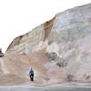 A worker walks up towards a plow smoothing a large salt pile at Eastern Salt Company in Chelsea, Mass., Thursday, Feb. 7, 2013, in preparation for a major winter storm headed toward the U.S. Northeast. The National Weather Service calls for up to 2 feet of snow expected for a Boston-area region that has seen mostly bare ground this winter.