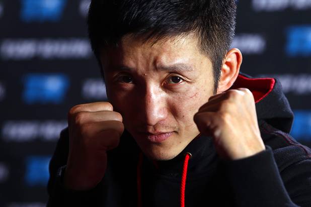 Chinese light flyweight boxer Zou Shiming poses after a workout in a training facility at the Palazzo in Las Vegas, Nevada February 8, 2013. Zou, a two-time Olympic gold medalist and three-time world amateur champion, will make his professional debut April 6 at the Venetian Macao Resort in Macau.