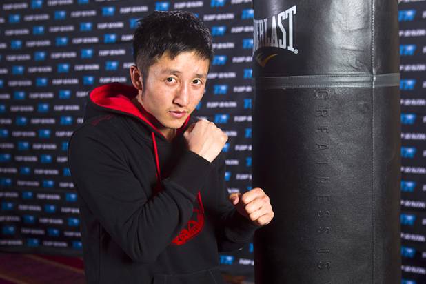 Chinese light flyweight boxer Zou Shiming poses after a workout in a training facility at the Palazzo in Las Vegas, Nevada February 8, 2013. Zou, a two-time Olympic gold medalist and three-time world amateur champion, will make his professional debut April 6 at the Venetian Macao Resort in Macau.