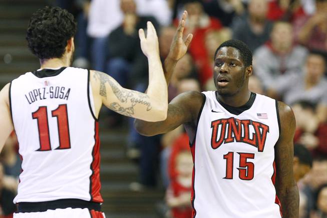 UNLV forward Carlos Lopez-Sosa and Anthony Bennett do a back-handed hand shake during their game against New Mexico during their game Saturday, Feb. 9, 2013 at the Thomas & Mack Center. UNLV beat New Mexico 64-55.