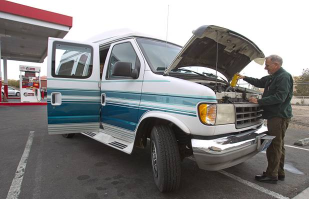 David Paulsen, a member of United Methodist Church in Boulder City, adds oil to his van before heading to Carson City Sunday, Feb. 10, 2013. Nevadans for the Common Good, a coalition of faith-based organizations, are learning about the legislative process as they lobby for Assembly Bill 67. The bill would strengthen the laws against sex traffickers.