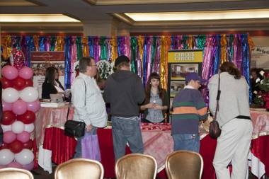 Visitors stop at the Circus Circus booth at the third annual LGBT Wedding Expo at the Strip resort on Feb. 10, 2013. The expo featured LGBT-friendly wedding vendors, wedding planning tips, a fashion show and giveaways. The event was sponsored by Rainbow Wedding Network.  