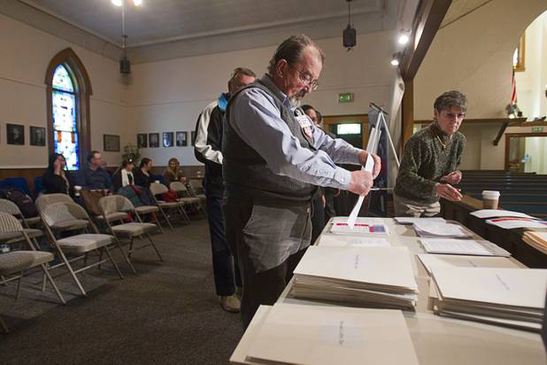 Chuckie Brice, a member of the University United Methodist Church in Las Vegas, organizes informational packets at the First United Methodist Church in Carson City Monday, Feb. 11, 2013. Nevadans for the Common Good, a coalition of faith-based organizations, are learning about the legislative process as they lobby for Assembly Bill 67. The bill would strengthen the laws against sex traffickers.