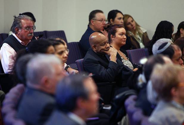 Rev. Dennis Hutson, center, of Advent United Methodist Church in Las Vegas, listens during a news conference at the State Legislature in Carson City Monday, Feb. 11, 2013. Nevadans for the Common Good, a coalition of faith-based organizations, are learning about the legislative process as they lobby for Assembly Bill 67. The bill would strengthen the laws against sex traffickers.