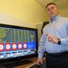 John Forelli, a vice president at the Borgata Hotel Casino & Spa in Atlantic City, demonstrates a new in-room gambling system Monday Feb. 11, 2013. The system will be available to guests starting Feb. 18. The casino says it is the first in the nation to offer this technology, which is says can be expanded to encompass hand-held gambling devices and even Internet betting once it is legalized.