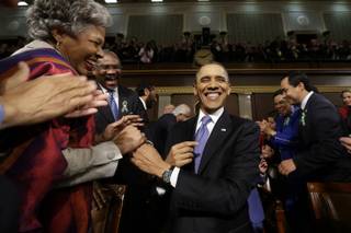 President Barack Obama is greeted before his State of the Union address during a joint session of Congress on Capitol Hill in Washington, Tuesday Feb. 12, 2013. 
