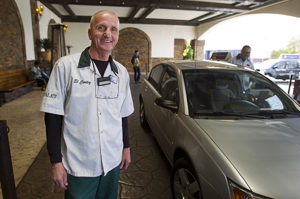 Valet attendant Leo Heffner poses at the porte cochere at the El Cortez in downtown Las Vegas Wednesday, Feb.13, 2013.