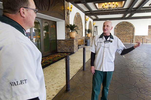 Valet attendant Leo Heffner, right, talks with fellow attendant Brian Geark at the El Cortez in downtown Las Vegas Wednesday, Feb.13, 2013.