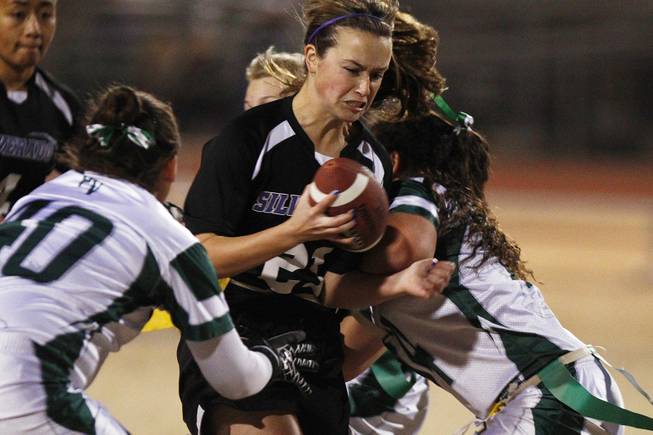 Silverado's Danni Parven tries to break through the Palo Verde defense during the district championship for flag football Wednesday, Feb. 13, 2013. Palo Verde won the game 7-6.