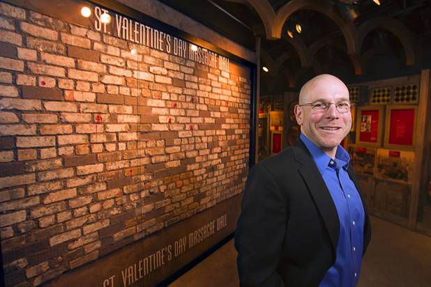 Jonathan Ullman, executive director and CEO of the Mob Museum, the National Museum of Organized Crime and Law Enforcement, poses in front of a bullet-pocked wall at the museum in downtown Las Vegas Wednesday, Feb.13, 2013. The wall is a portion of the warehouse wall where the St. Valentine's Day massacre occurred on Feb. 14, 1929. The museum celebrates it's first anniversary on Valentine's Day.
