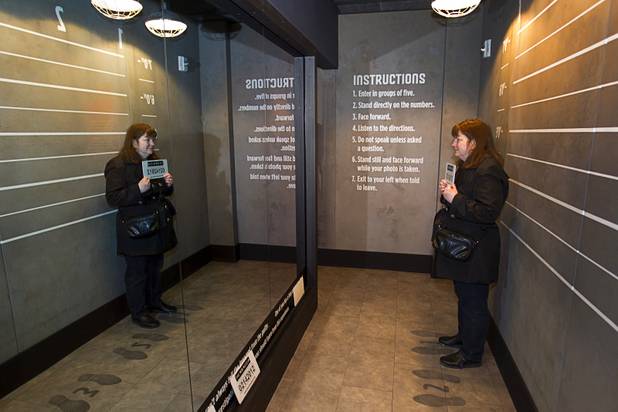 Patricia Brown of Anchorage, Alaska poses for a line-up photo at the Mob Museum, the National Museum of Organized Crime and Law Enforcement, in downtown Las Vegas Wednesday, Feb.13, 2013. The museum celebrates it's first anniversary on Valentine's Day.
