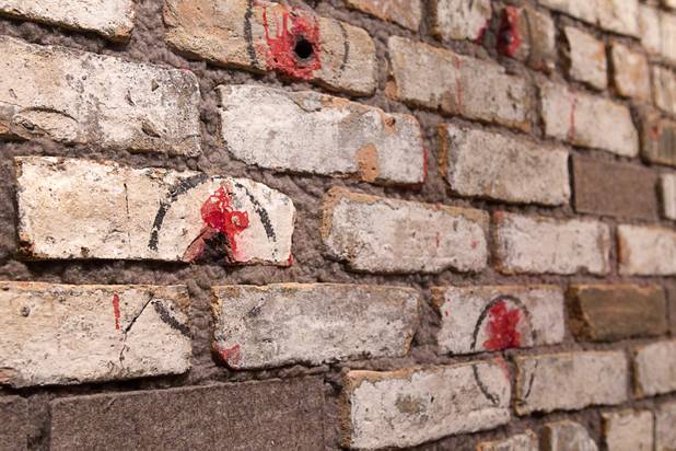 A bullet-pocked wall from the St. Valentine's Day massacre is displayed at the museum in downtown Las Vegas Wednesday, Feb.13, 2013. The massacre occurred in Chicago on Feb. 14, 1929. Seven mobsters belonging to the Bugs Moran gang were murdered. The museum celebrates it's first anniversary on Valentine's Day.