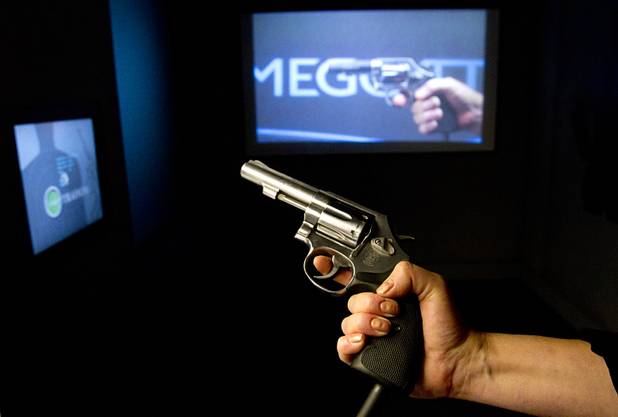 A revolver, used for a police training simulator, is displayed at the Mob Museum, the National Museum of Organized Crime and Law Enforcement, in downtown Las Vegas Wednesday, Feb.13, 2013. The museum celebrates it's first anniversary on Valentine's Day.