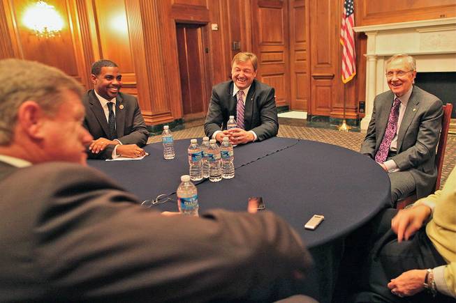 From left to right, Nevada Rep. Steven Horsford, Sen. Dean Heller and Sen. Harry Reid laugh at a joke made by Rep. Mark Amodei, in the foreground, at the first official meeting of the full Nevada congressional delegation in several years, Feb. 13, 2013.