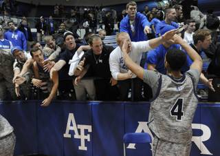 Air Force's Kamryn Williams greets fans Air Force defeated UNLV 71-56 during an NCAA college basketball game Wednesday, Feb. 13, 2013, at Air Force Academy, Colo. (AP Photo/The Gazette, Jerilee Bennett)