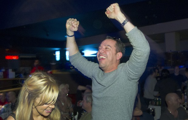 A Ravens fan cheers after a score by Baltimore during a Super Sunday party at Sapphire Las Vegas Sunday, Feb. 3, 2013.