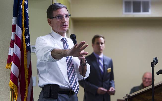Congressman Joe Heck (R-NV) tries to respond to argumentative questioner during a town hall meeting with constituents at Pacific Pines Senior Apartments in Henderson Tuesday, Feb.19, 2013.