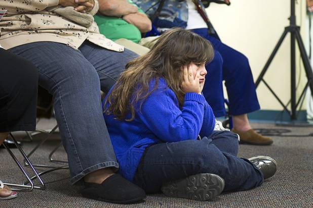 Zelene Garcia, 9, attends a town hall meeting with Congressman Joe Heck (R-NV) at Pacific Pines Senior Apartments in Henderson Tuesday, Feb.19, 2013. Garcia was at the meeting with her grandmother.