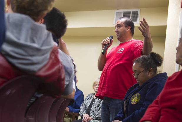 Clark County School District teacher Adam Berg, asks a question about the possible impact of "sequestration" cuts on federal education programs during a town hall meeting with Congressman Joe Heck (R-NV)  at Pacific Pines Senior Apartments in Henderson Tuesday, Feb.19, 2013.