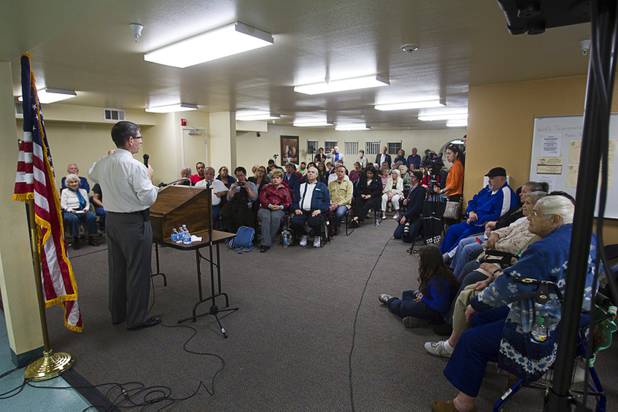 Congressman Joe Heck, left, (R-NV) responds to a question during a town hall meeting with constituents at Pacific Pines Senior Apartments in Henderson Tuesday, Feb.19, 2013.