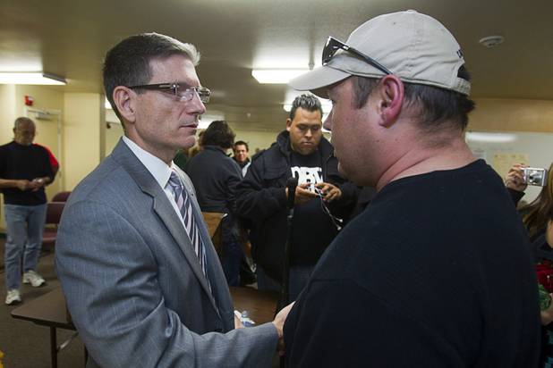 Congressman Joe Heck, left, (R-NV) talks with a constituent at the conclusion of a town hall meeting at Pacific Pines Senior Apartments in Henderson Tuesday, Feb.19, 2013.
