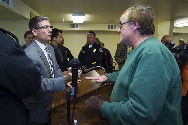 Congressman Joe Heck, left, (R-NV) talks with George Matthews about possible gun control legislation during a town hall meeting with constituents at Pacific Pines Senior Apartments in Henderson Tuesday, Feb.19, 2013.