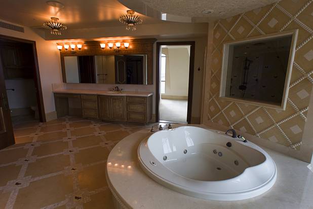 A bathtub is shown in one to the master bedroom's two baths in a penthouse at One Queensridge Place, a luxury condo development near Summerlin, Tuesday, Feb. 19, 2013. The development is starting to see sales pick up after falling to almost nothing during the recession.