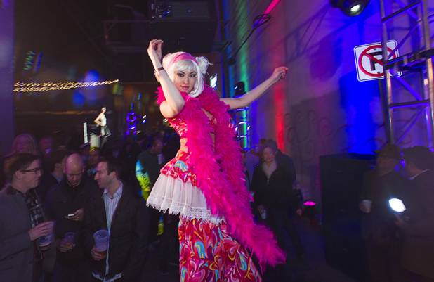 A performer on stilts dances during the second annual Fashion Alley in downtown Las Vegas Wednesday, Feb. 20, 2013.