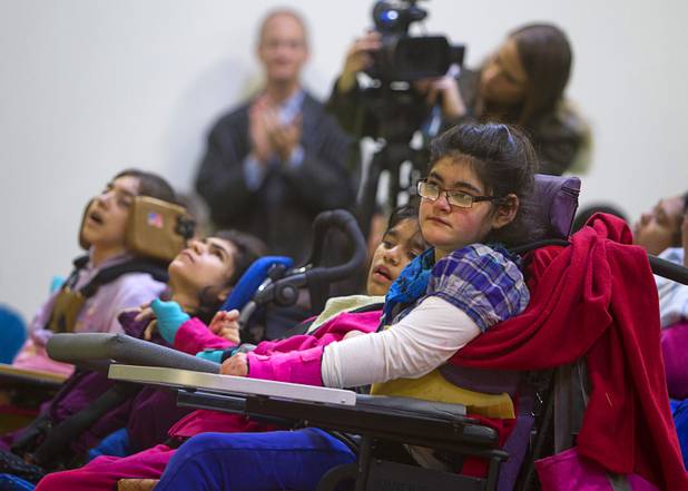 Students wait for official opening ceremony at the new John F. Miller School, a school which serves students with disabilities and special needs, Wednesday Feb. 20, 2013. The school has been nominated for a national design award.