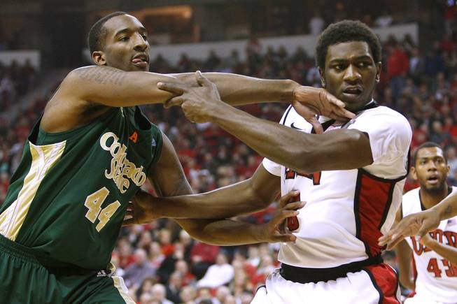 UNLV forward Savon Goodman and Colorado State forward Greg Smith bang in the paint during their Mountain West Conference game Wednesday, Feb. 20, 2013 at the Thomas & Mack. UNLV won 61-59.