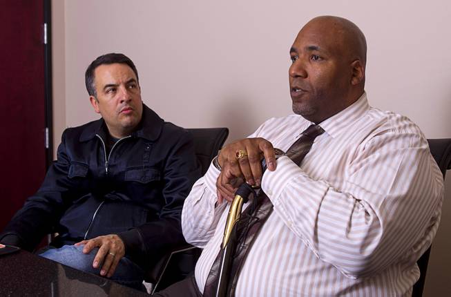 Rudy Gibson talks about his younger brother Stanley during an interview in his attorney's office in Henderson Thursday, Feb. 21, 2013. Attorney Andre Lagomarsino listens at left. Stanley Gibson was killed in an officer-involved shooting in December of 2011.