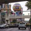 Wrecked cars are shown on Las Vegas Boulevard and Flamingo Avenue as Las Vegas Metro Police investigate a shooting and multi-car accident that left three people dead and three injured on the Las Vegas Strip early Thursday morning, Feb. 21, 2013.