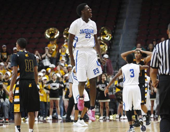 Desert Pines Rameek Keith jumps in the air as the Jaguars finally hold a lead over Clark during their Class 1A basketball championship game Saturday, Feb. 23, 2013 at the Orleans Arena. After trailing almost the whole game, Desert Pines came from behind to win 59-57