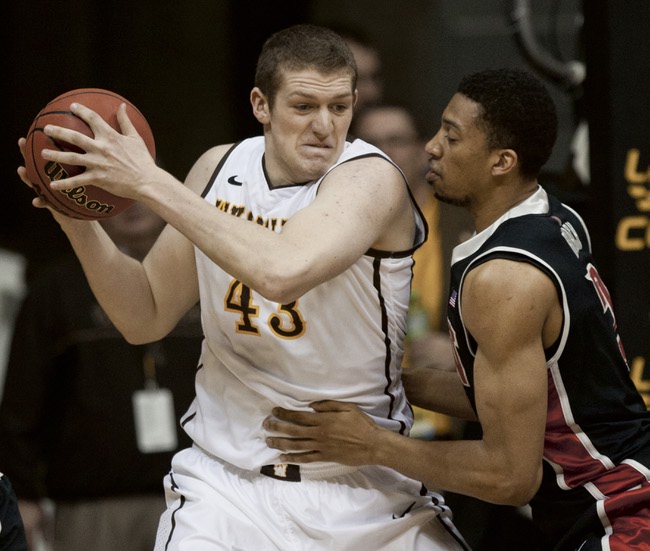 Wyoming's Matt Sellers (43) tries to get inside against UNLV defender Khem Birch (2) during an NCAA college basketball game Saturday, Feb. 23, 2013, in Laramie, Wyo. UNLV won 65-42. (AP Photo/Laramie Boomerang, Jeremy Martin)