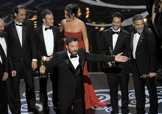 Director/producer Ben Affleck accepts the award for best picture for 