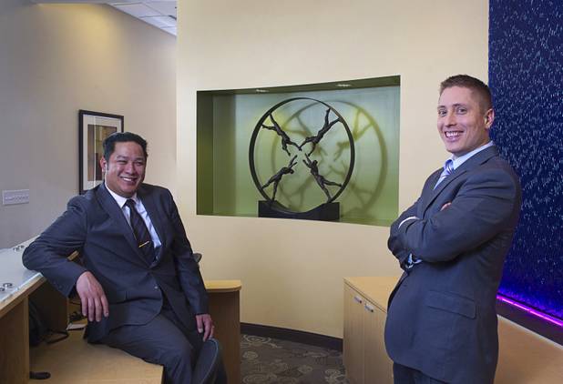 Executive suites managers Leo Agustin, left, and Michael Hatcher pose in the lobby of the Tivoli Village Executive Suites Tuesday, Feb. 25, 2013. Hatcher manages suites on Howard Hughes Parkway. Agustin manages the Tivoli Village property.