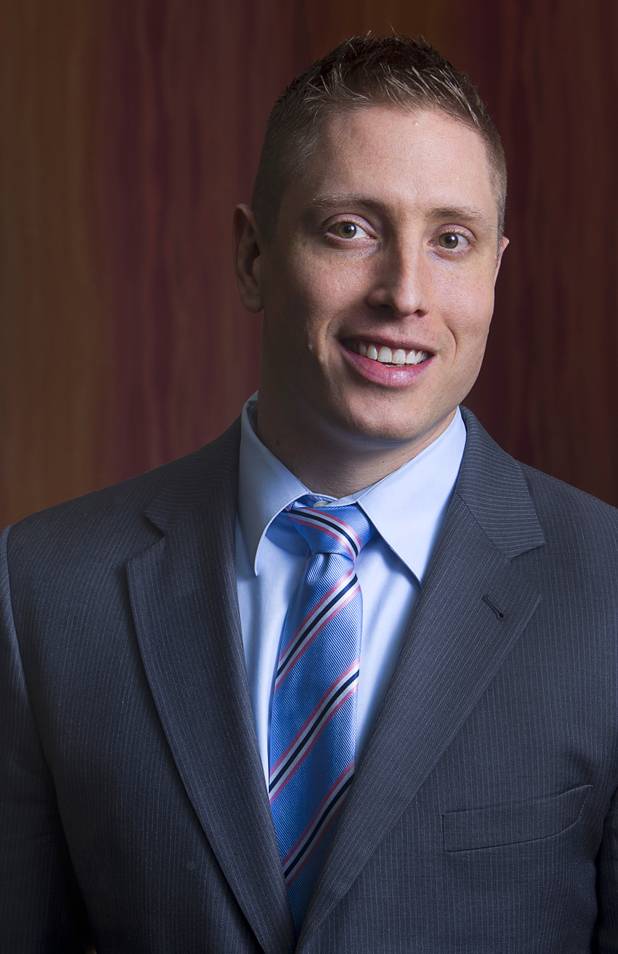 Executive suites manager Michael Hatcher poses at the Tivoli Village Executive Suites Tuesday, Feb. 25, 2013. Hatcher manages executive office suites on Howard Hughes Parkway.