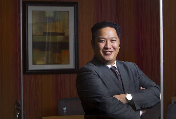 Executive suites manager Leo Agustin poses at the Tivoli Village Executive Suites Tuesday, Feb. 25, 2013.