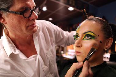 Roger Stricker, the wigs and makeup supervisor at “Zumanity,” tests the “One Night for One Drop” makeup for performer Gyulnara Karaeva inside the “Zumanity” hair and makeup room at New York New York Hotel & Casino in Las Vegas on Tuesday, February 26, 2013.