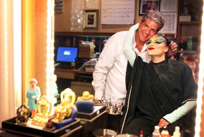Roger Stricker, the wigs and makeup supervisor at "Zumanity," gets a hug after testing the "One Night for One Drop" makeup on performer Gyulnara Karaeva inside the "Zumanity" hair and makeup room at New York New York Hotel & Casino in Las Vegas on Tuesday, February 26, 2013.