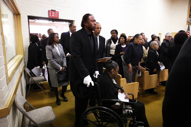 Family members of Michael Boldon enter the church before the memorial service for Michael Boldon at Holy Trinity AME Church in North Las Vegas on Wednesday, Feb. 27, 2013. Boldon was killed in his cab Feb. 21, the result of a fiery crash after a shootout on the Las Vegas Strip.