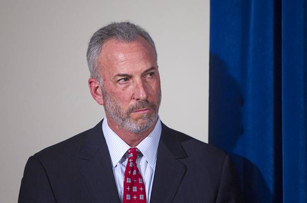 Clark County District Attorney Steve Wolfson listens to Sheriff Douglas Gillespie during a news conference at Las Vegas Metropolitan Police headquarters Thursday, Feb. 28, 2013 after Ammar Harris was arrested in North Hollywood. Harris, 26, is the suspect of last Thursday's shooting and accident on the Las Vegas Strip that left three people dead.