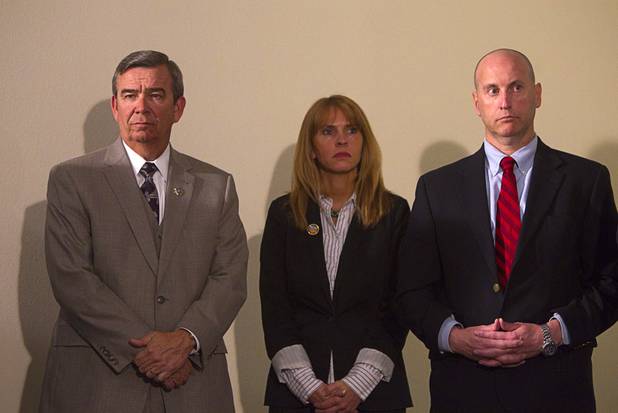 Sheriff Douglas Gillespie, left, Elena Aitarola, FBI supervisory special agent, and Bill Woerner, acting special agent-in-charge at the FBI Las Vegas Field Office, attend a news conference at Las Vegas Metropolitan Police headquarters Thursday, Feb. 28, 2013 after Ammar Harris was arrested in North Hollywood. Harris, 26, is the suspect of last Thursday's shooting and accident on the Las Vegas Strip that left three people dead.