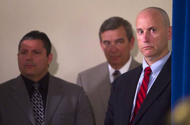 Metro Police Lt. Ray Steiber, left, Sheriff Douglas Gillespie, center, and Bill Woerner, acting special agent-in-charge at the FBI Las Vegas Field Office, listen to Clark County District Attorney Steve Wolfson during a news conference at Las Vegas Metropolitan Police headquarters Thursday, Feb. 28, 2013 after Ammar Harris was arrested in North Hollywood. Harris, 26, is the suspect of last Thursday's shooting and accident on the Las Vegas Strip that left three people dead.